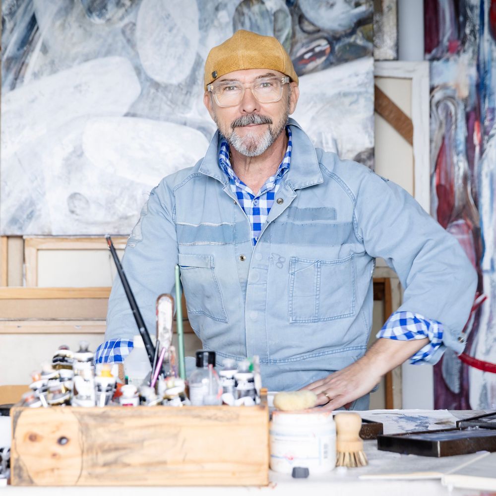 Peter Francis Lawrence
Portrait of a man in his 60's
He is an artist sitting in his studio wearing his painting clothes.Glass, hat beard