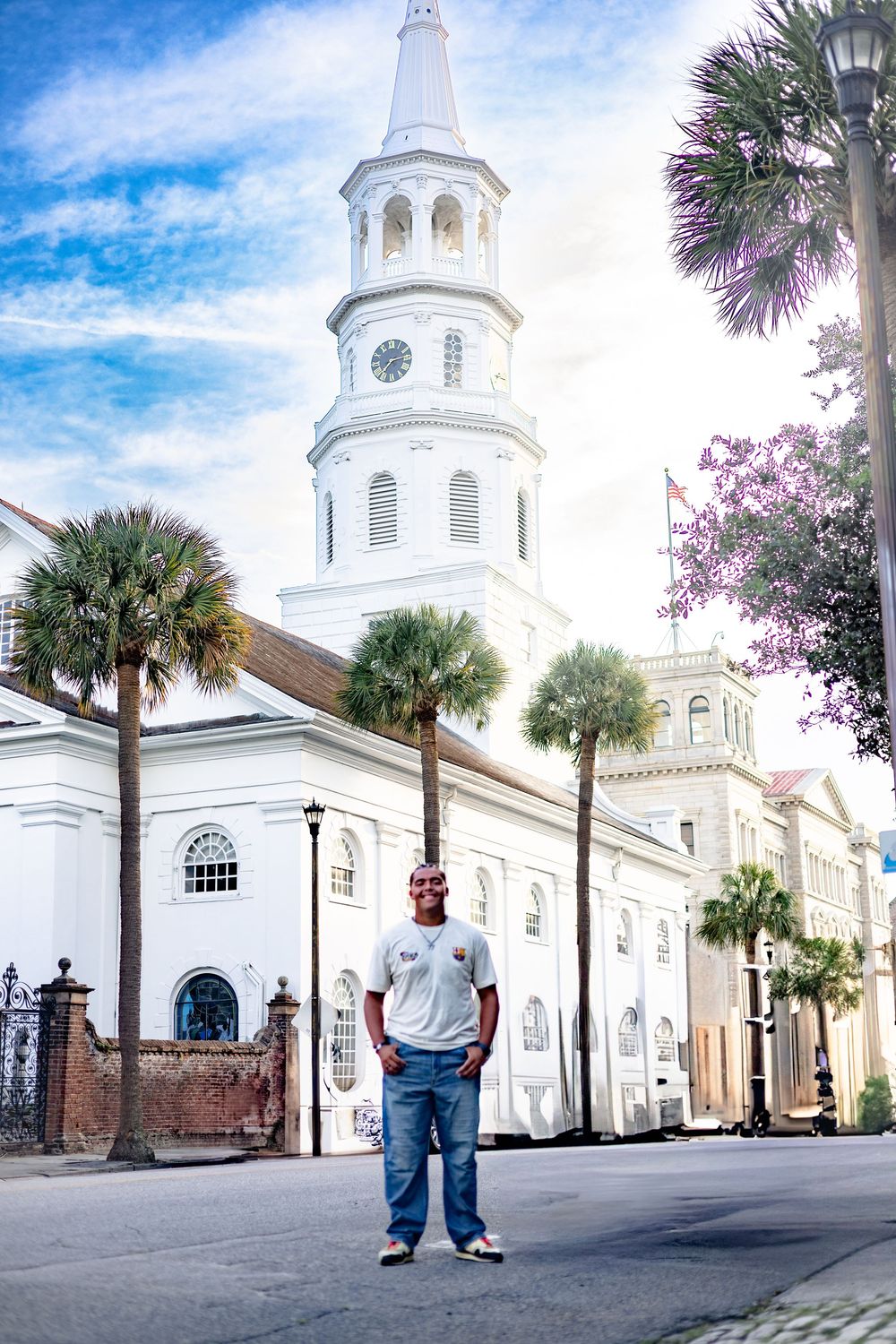 Historic St. Michael's Church in Charleston with its iconic white steeple and palm trees along Broad Street.
