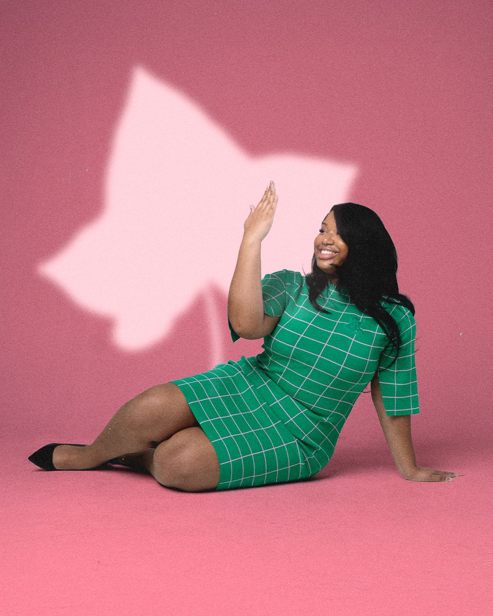 Artistic fashion poses against pink backdrop with dramatic shadows.