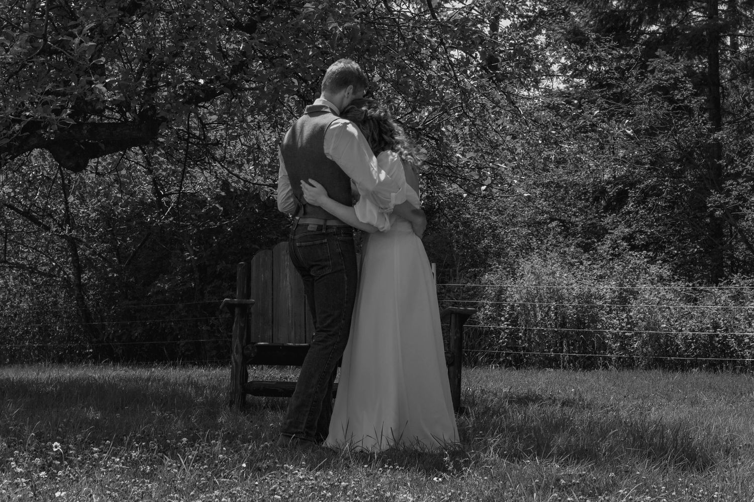 Black and white photo of couple outdoors for first day at backyard family property wedding in Bonners Ferry, Northern ID.