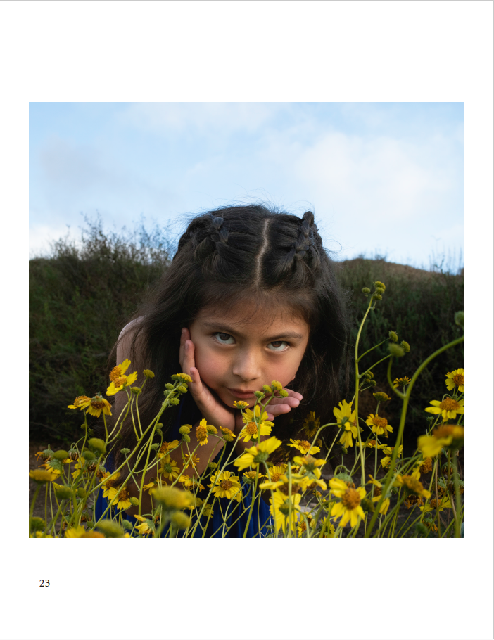 girl smelling flowers