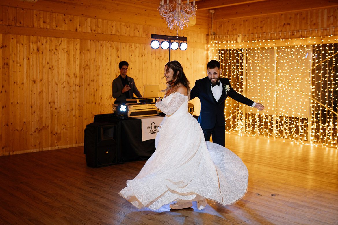 A series of wedding reception photos showing couples dancing in a rustic wooden venue with string lights.