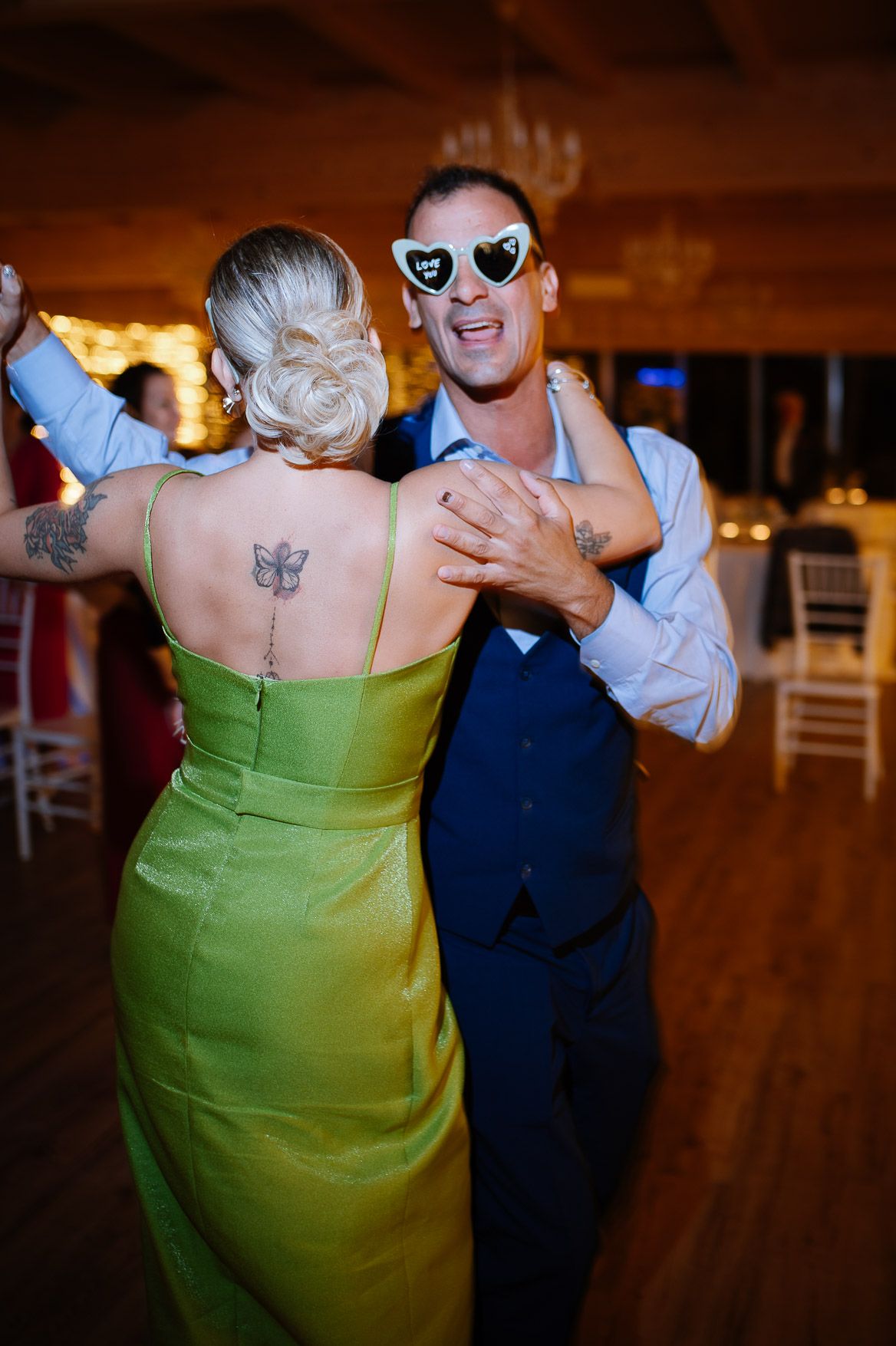 A sequence of dance photos showing people in formal wear with one wearing a lime green dress on a wooden dance floor.