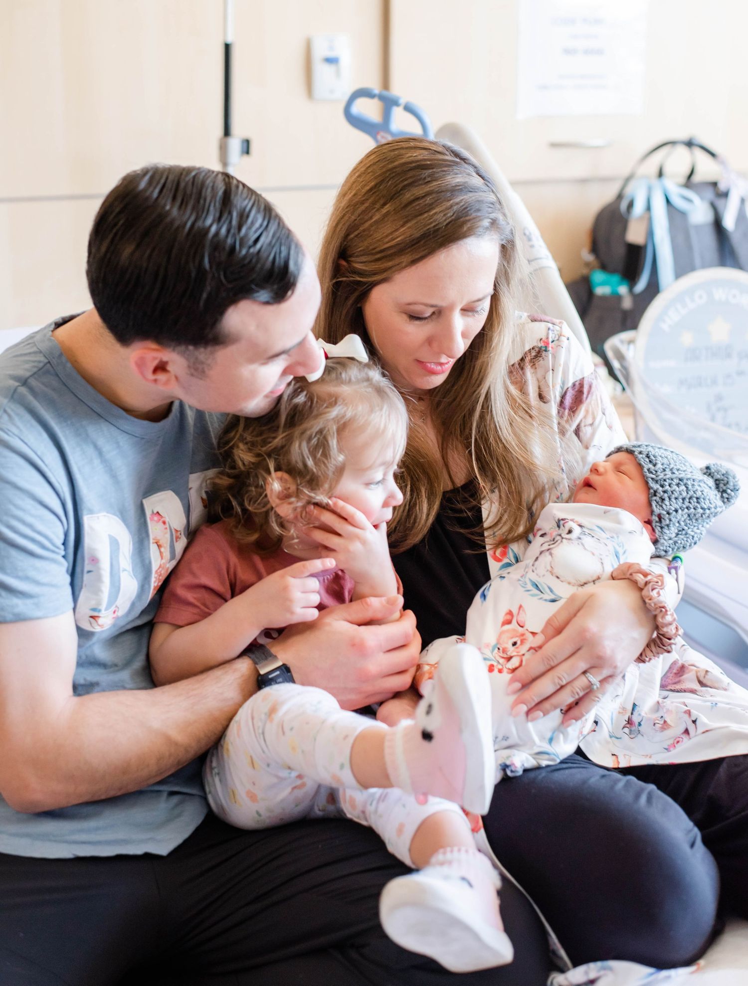 A sequence of intimate family moments captured on a couch showing gentle interactions and embraces.