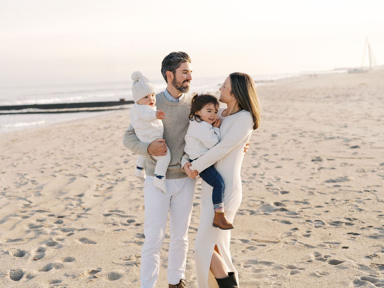 Emotional family moment photographed on a calm fall beach in New Jersey.