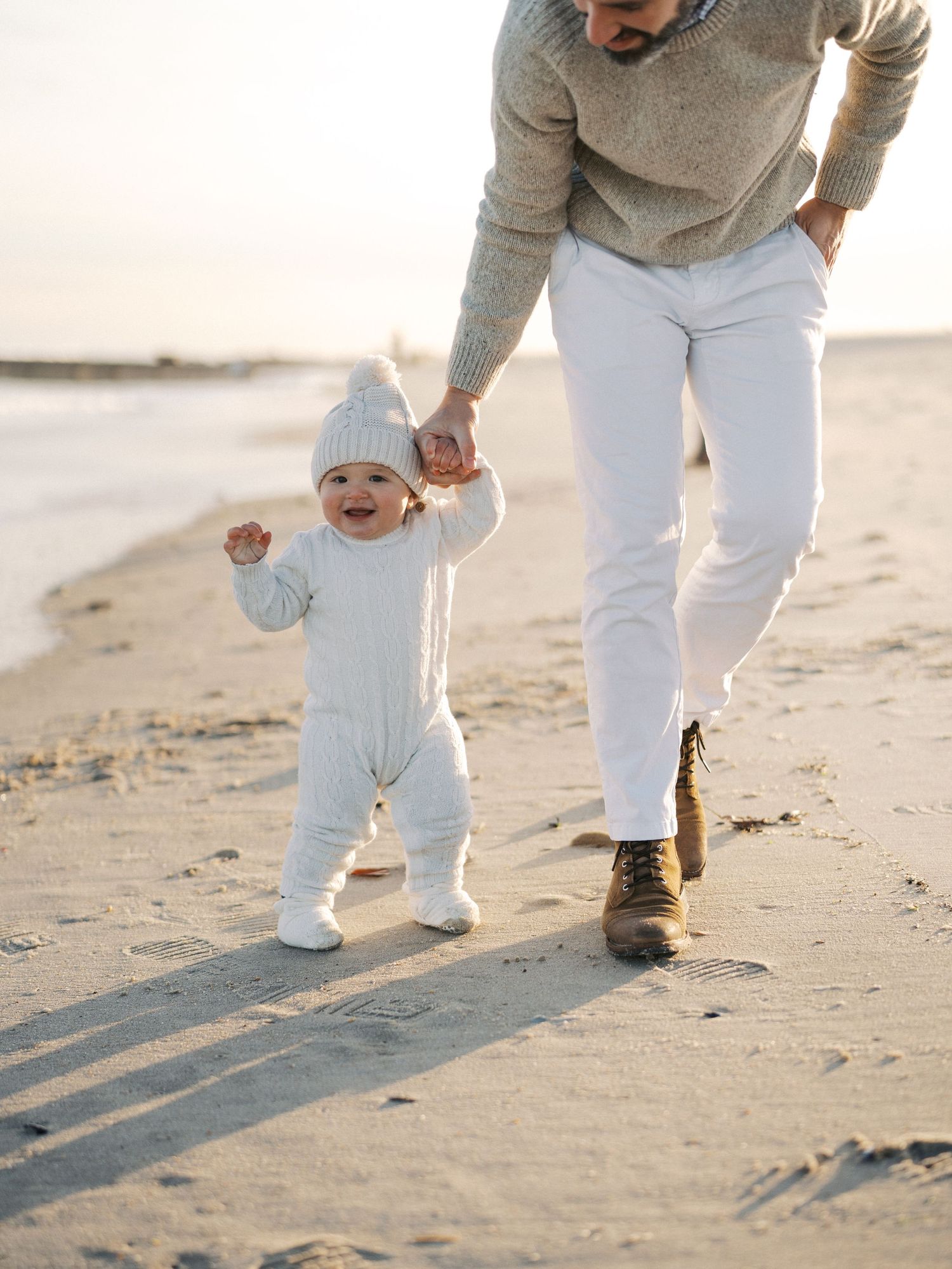 Father and son walking along the beach during a fall photography session in Spring Lake NJ