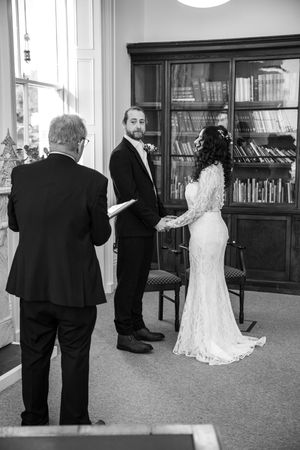 Black and white wedding photo sequence showing a couple in formal attire in a library setting.