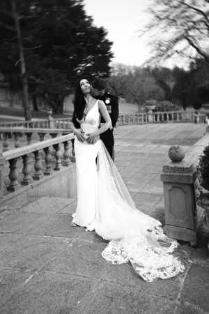 Black and white wedding portraits on a historic stone terrace with decorative balustrades. Elfordleigh, Plymouth Devon