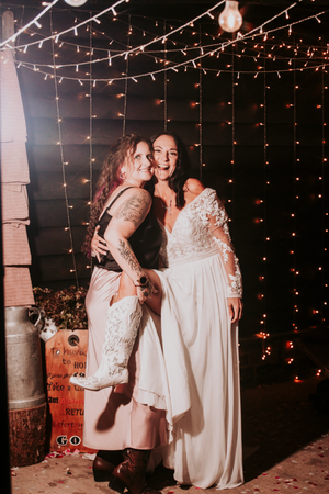 Wedding celebration under twinkling lights creating a magical evening atmosphere.