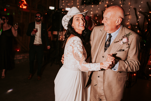 Wedding guests dancing and celebrating during an evening reception. Father Daughter Dance, Direct Flash, Over Barn, Gloucester,