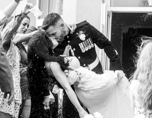 A series of black and white photos showing people spraying champagne in celebration. Confetti Moment at Elfordleigh Wedding