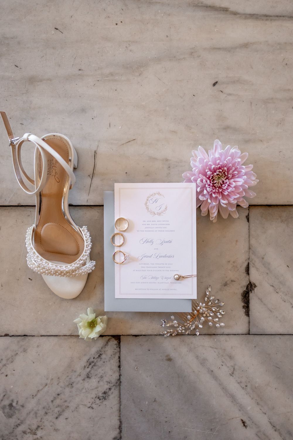 Wedding details flatlay with bridal shoes, invitation, rings and pink flowers on stone surface. NASHVILLE WEDDING PHOTOGRAPHER