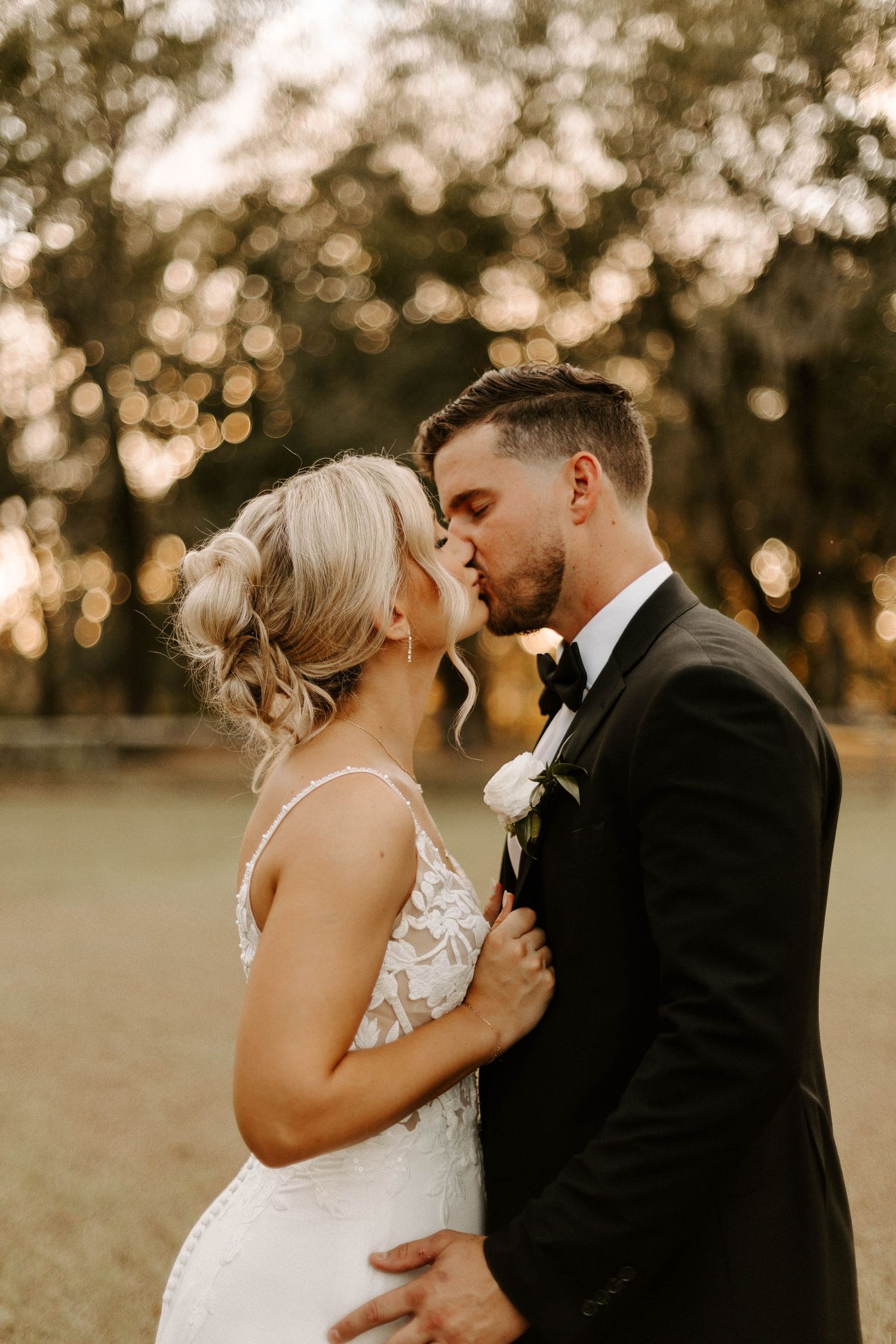 Black and white sequence showing hands tenderly embracing the back of someone's neck in an intimate moment.