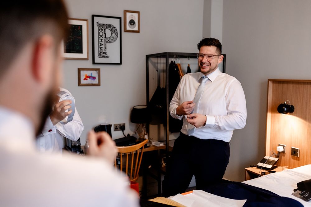 Candid moments of people in white shirts enjoying conversation in a room.