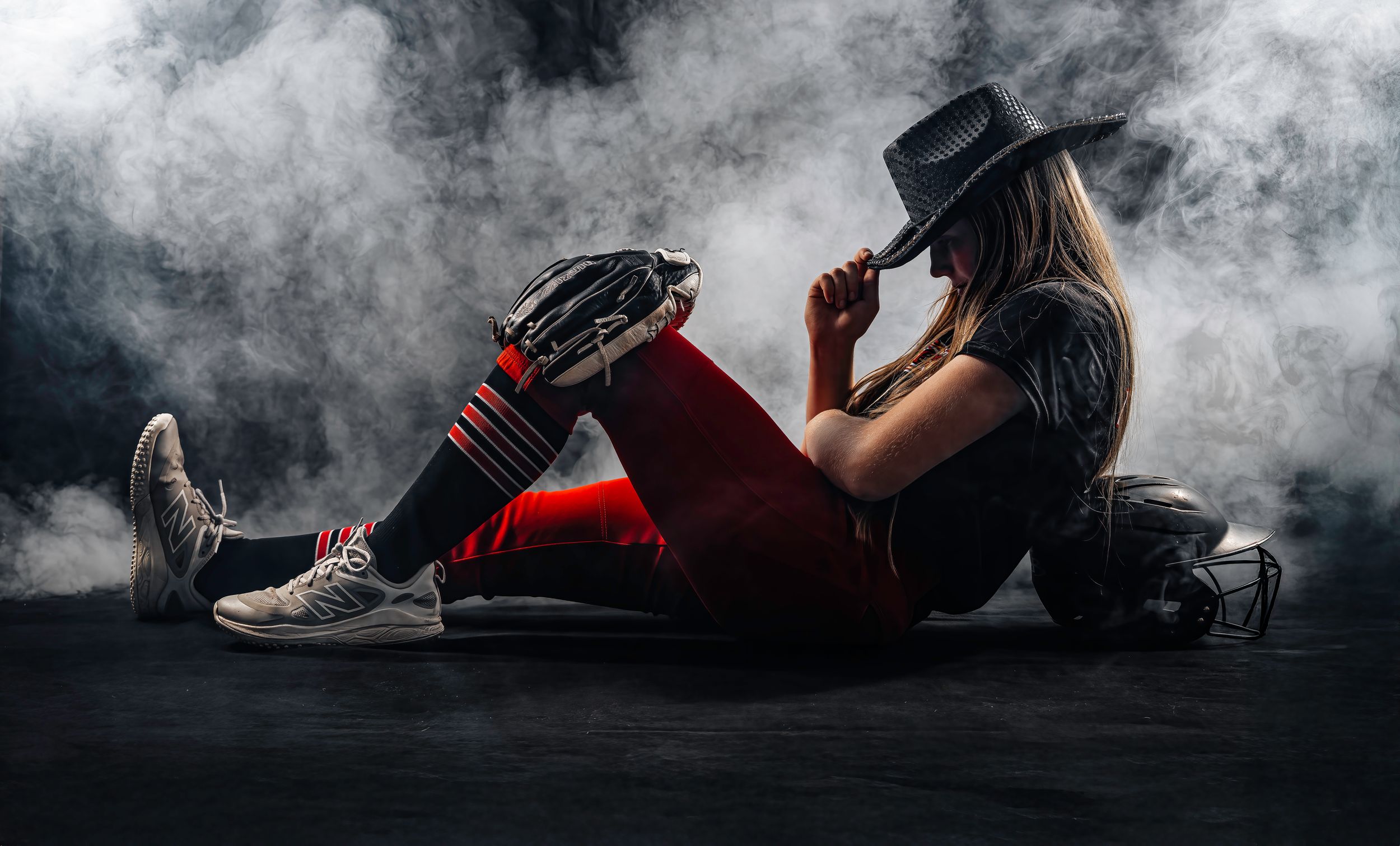 Artistic photo sequence showing a person lying down in smoke with dramatic lighting and red accents.