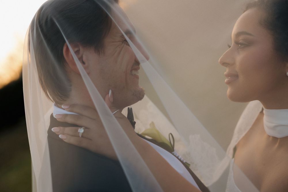 A romantic wedding photoshoot montage showing tender moments between a bride and groom in soft lighting.