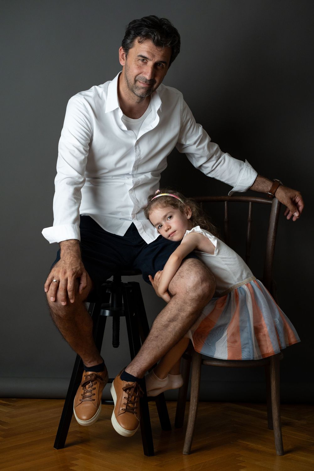 A studio portrait - Father and daughter.