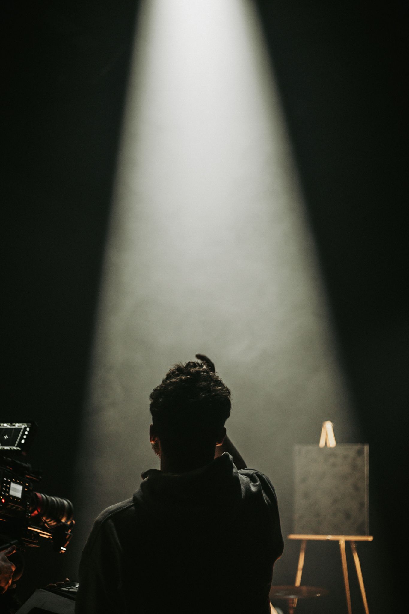 Dark film shoot with haze in a spotlight