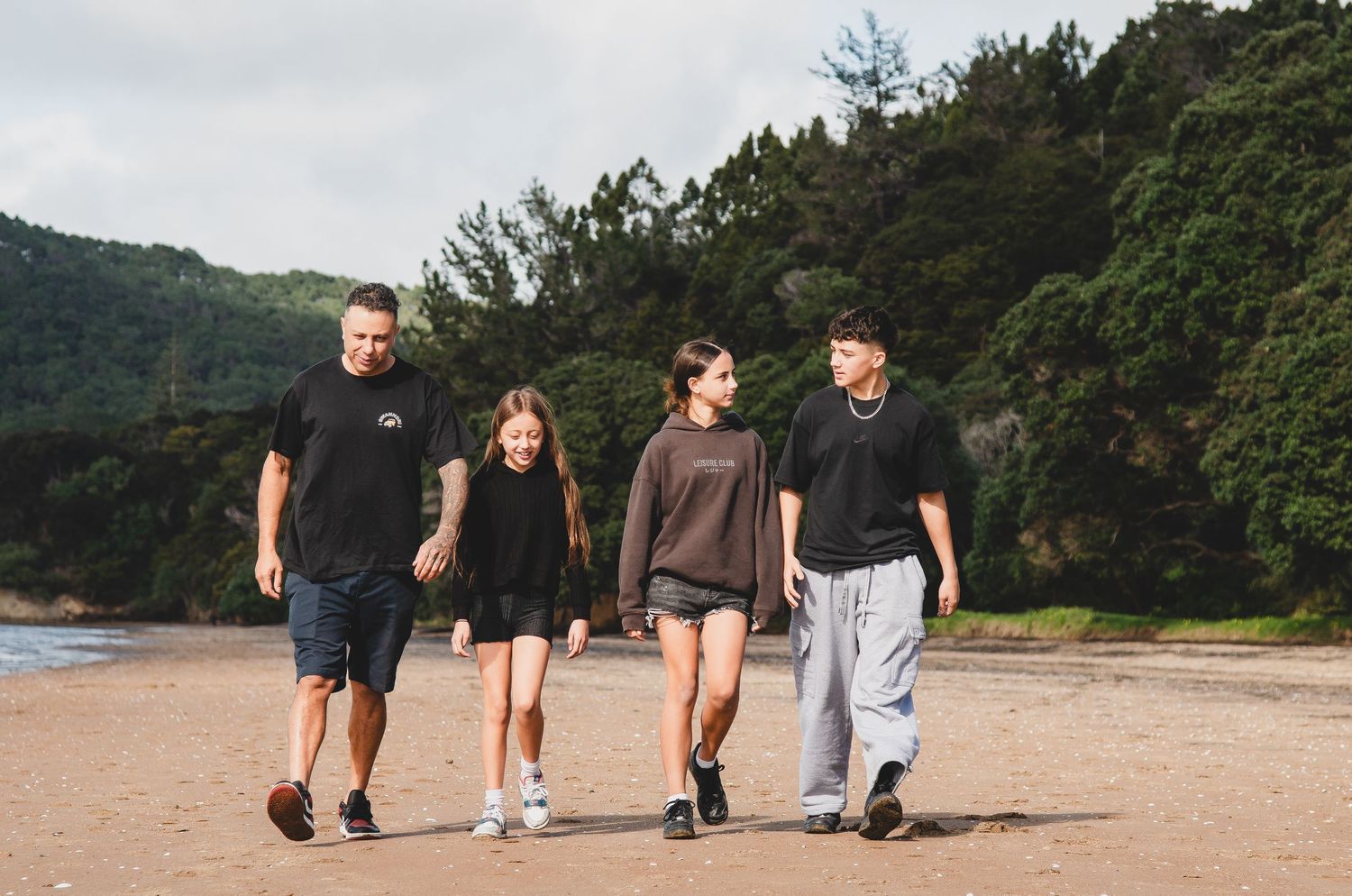 Family beach shoot, outdoor family shoot on a beach. Family walking on a beach, New Zealand Photographer