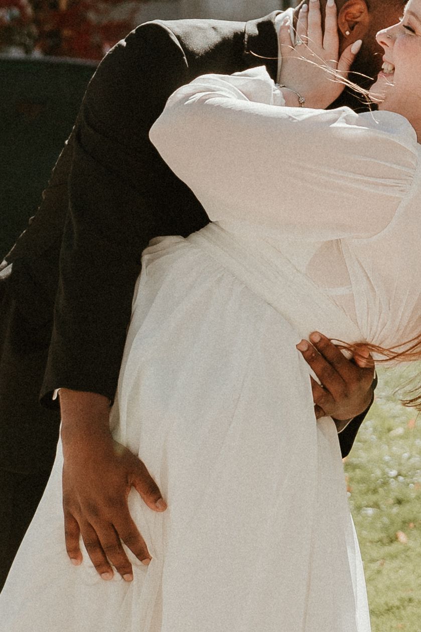 Intimate close-up shots of a couple embracing during their wedding celebration.