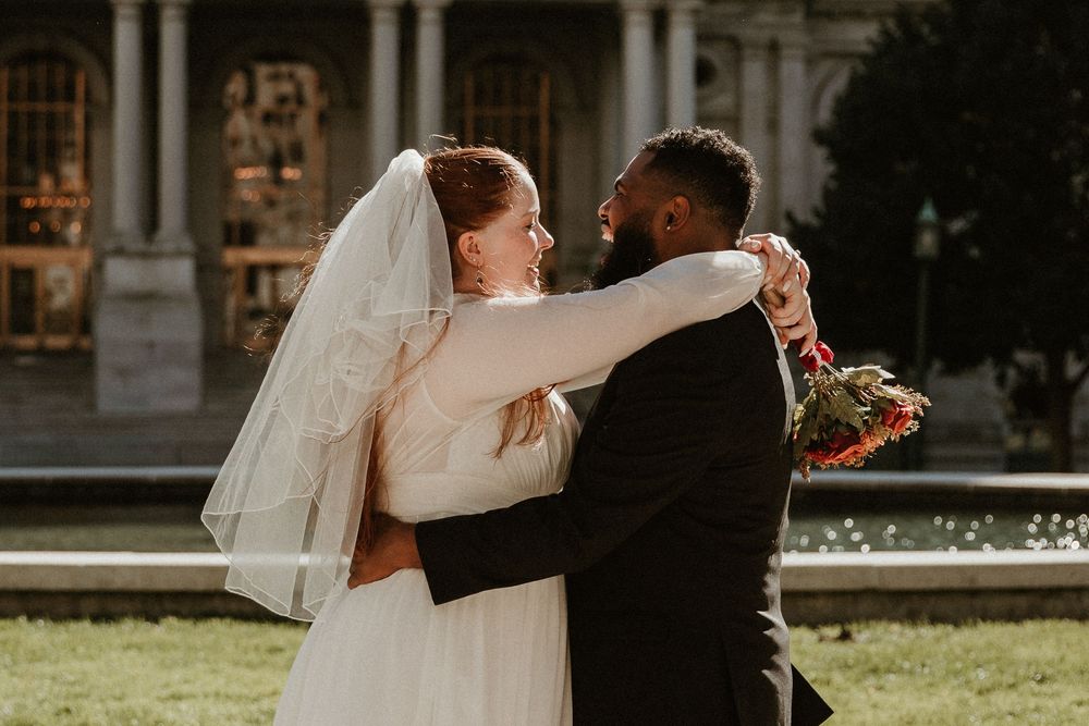 Romantic wedding portraits captured against the backdrop of a stunning historic building.