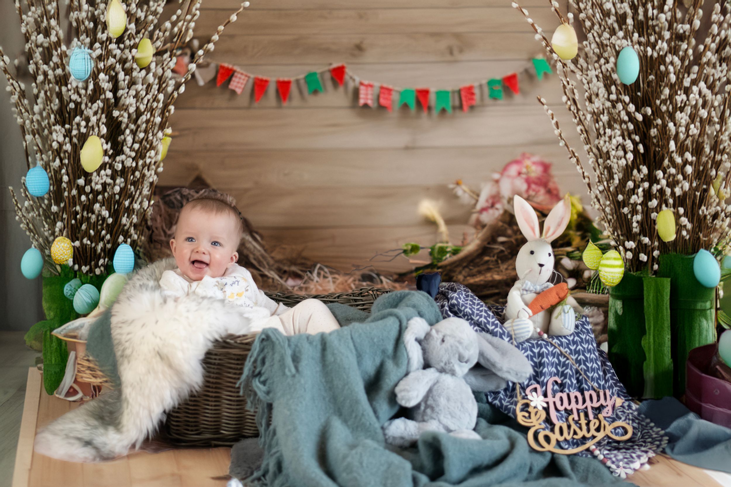 Easter themed photo setup with white twinkle lights, colorful bunting, spring decor, and a rustic wooden backdrop.