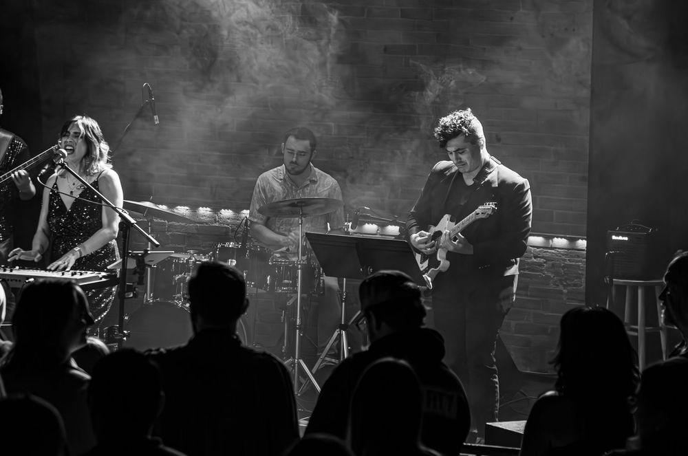 Jazz funk band preforming on stage.
