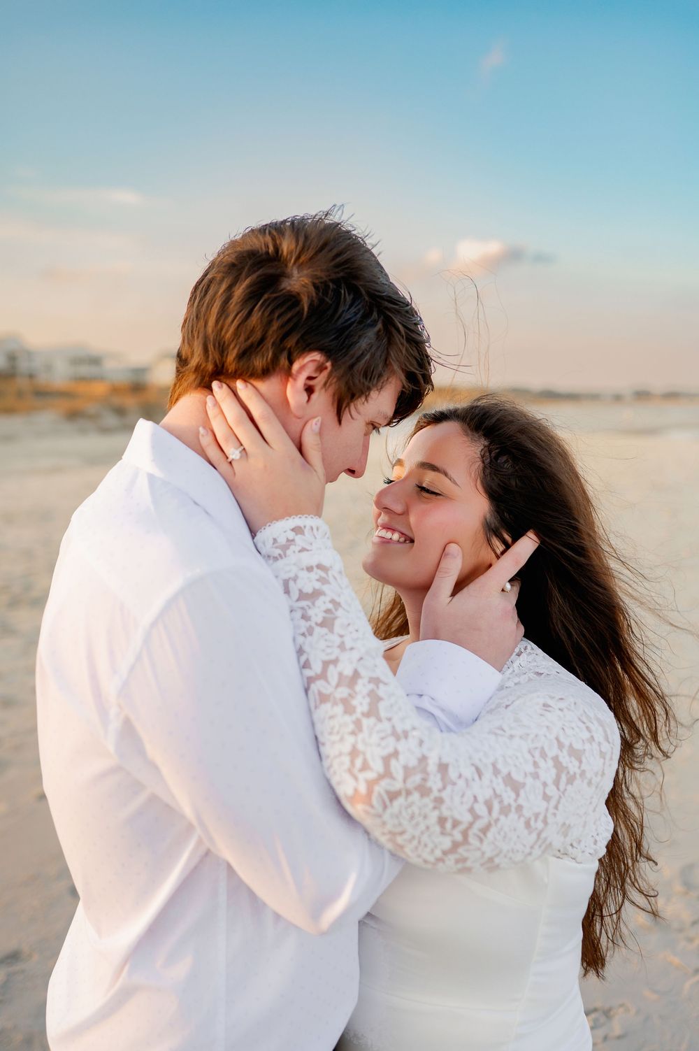 Romantic close-up shots showing tender moments between couple on sunny beach.