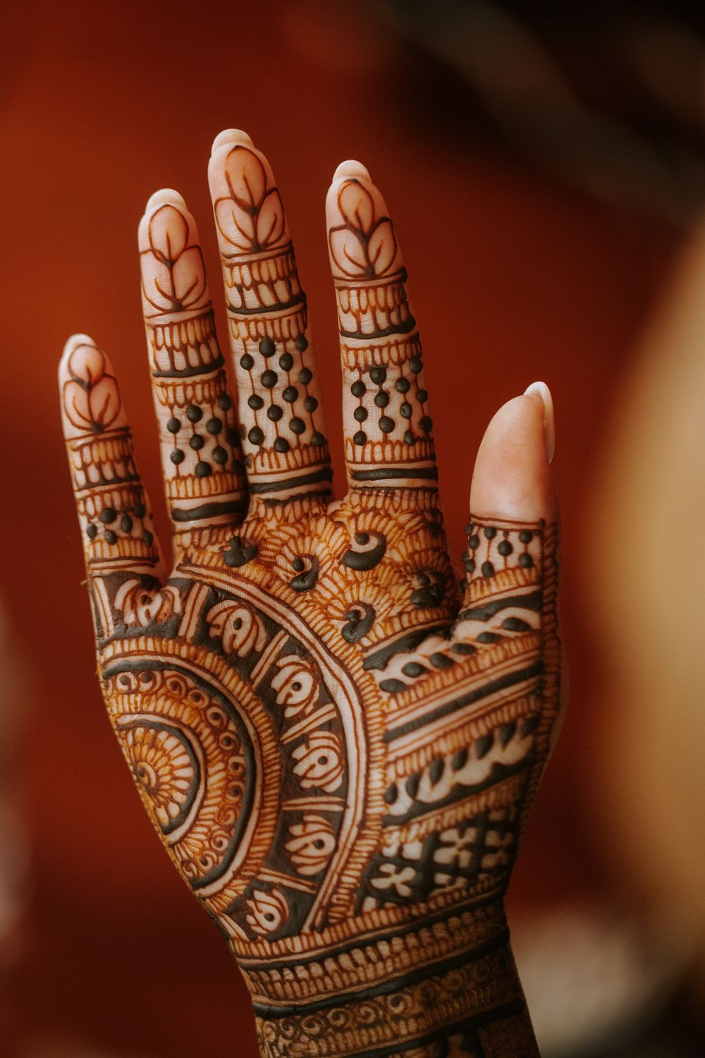 Intricate henna design on palm featuring traditional Indian mehndi patterns.