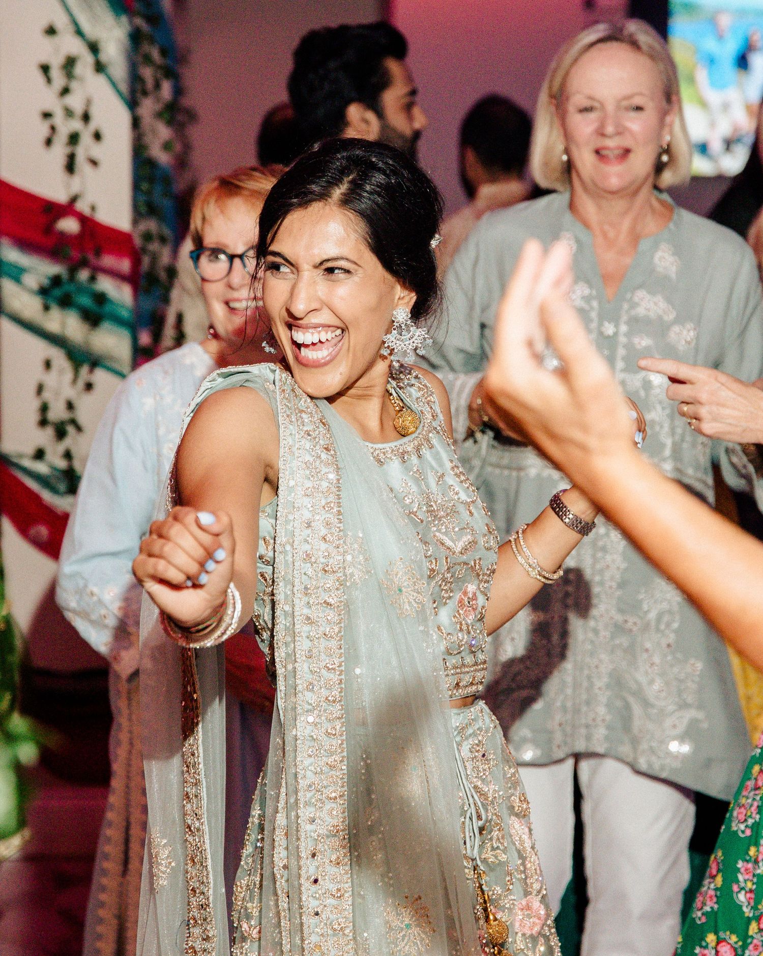 Dancing at her traditional Indian wedding