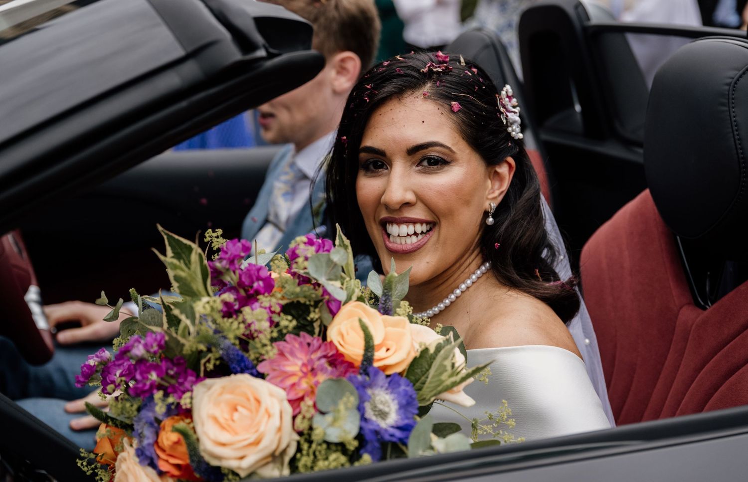 A delighted bride being whisked away