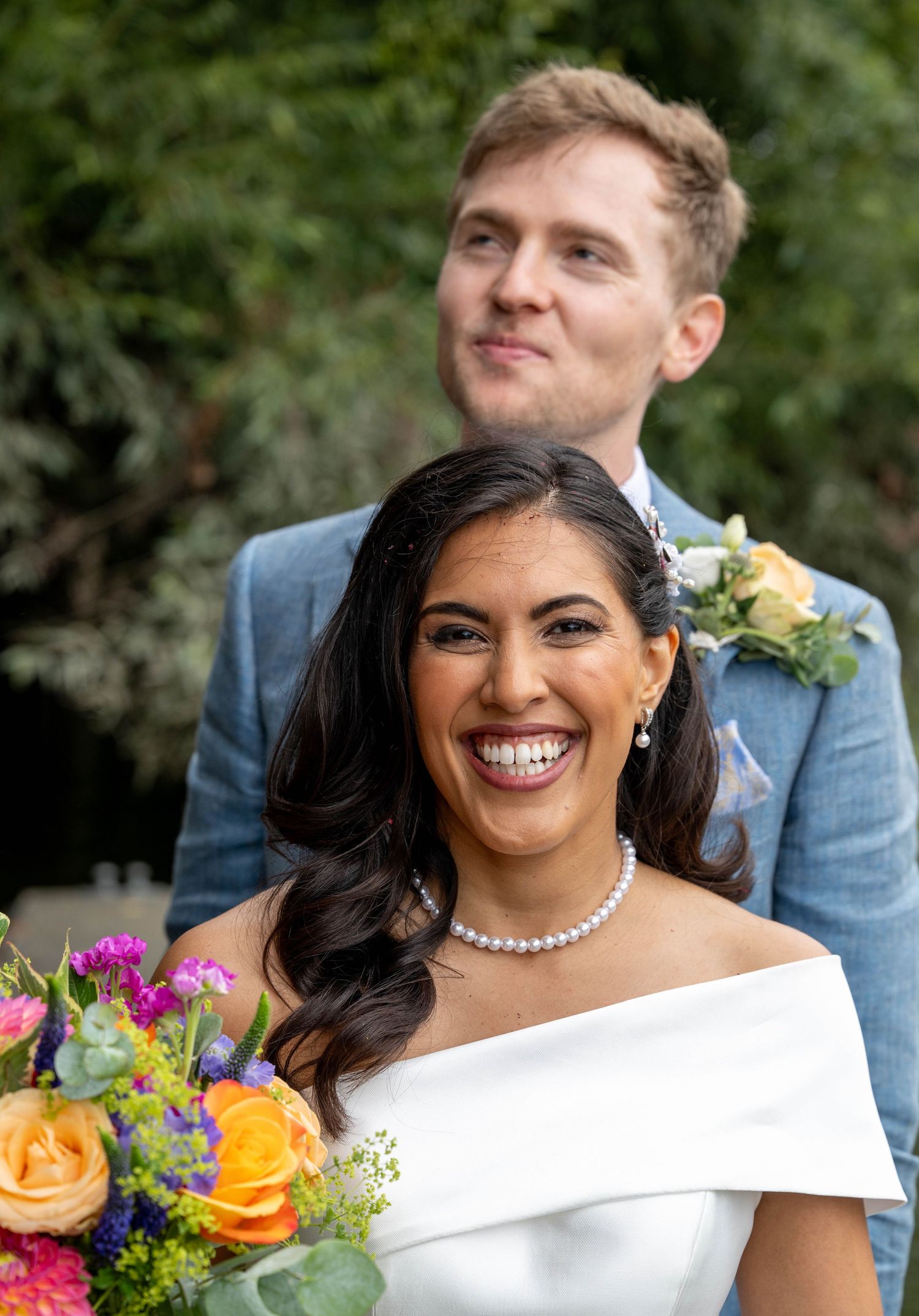 A summer wedding on the Thames. Soft waves and a side pin back with natural tones for the brides makeup