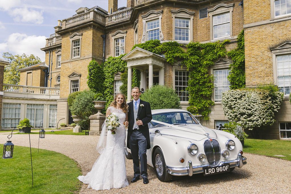 Stately home and vintage car for this classic Surrey wedding.