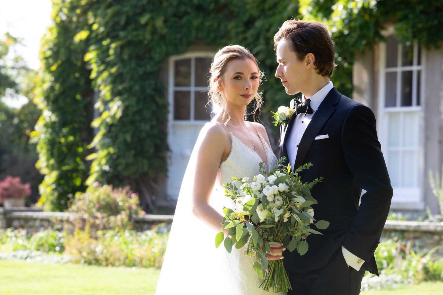 Soft elegance for this bride with a swept back, simple bun