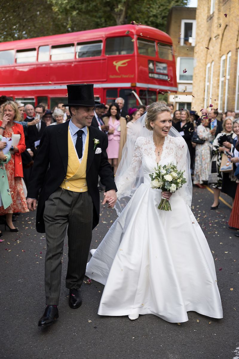 A  swantky London wedding, complete with wedding bus. A very classic look for the bride with a swept back bun and natural makeup.