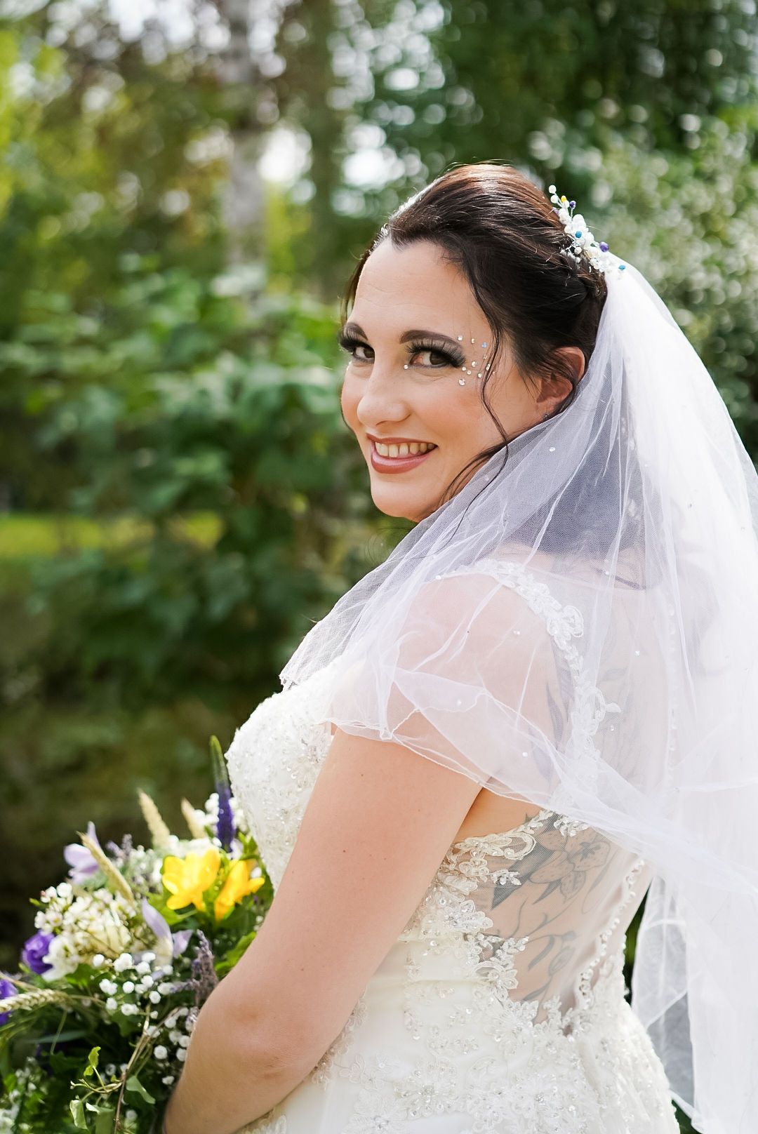 Lots of glamour; smoky eyes and tiny diamonte crystals for this lovely unique bride.