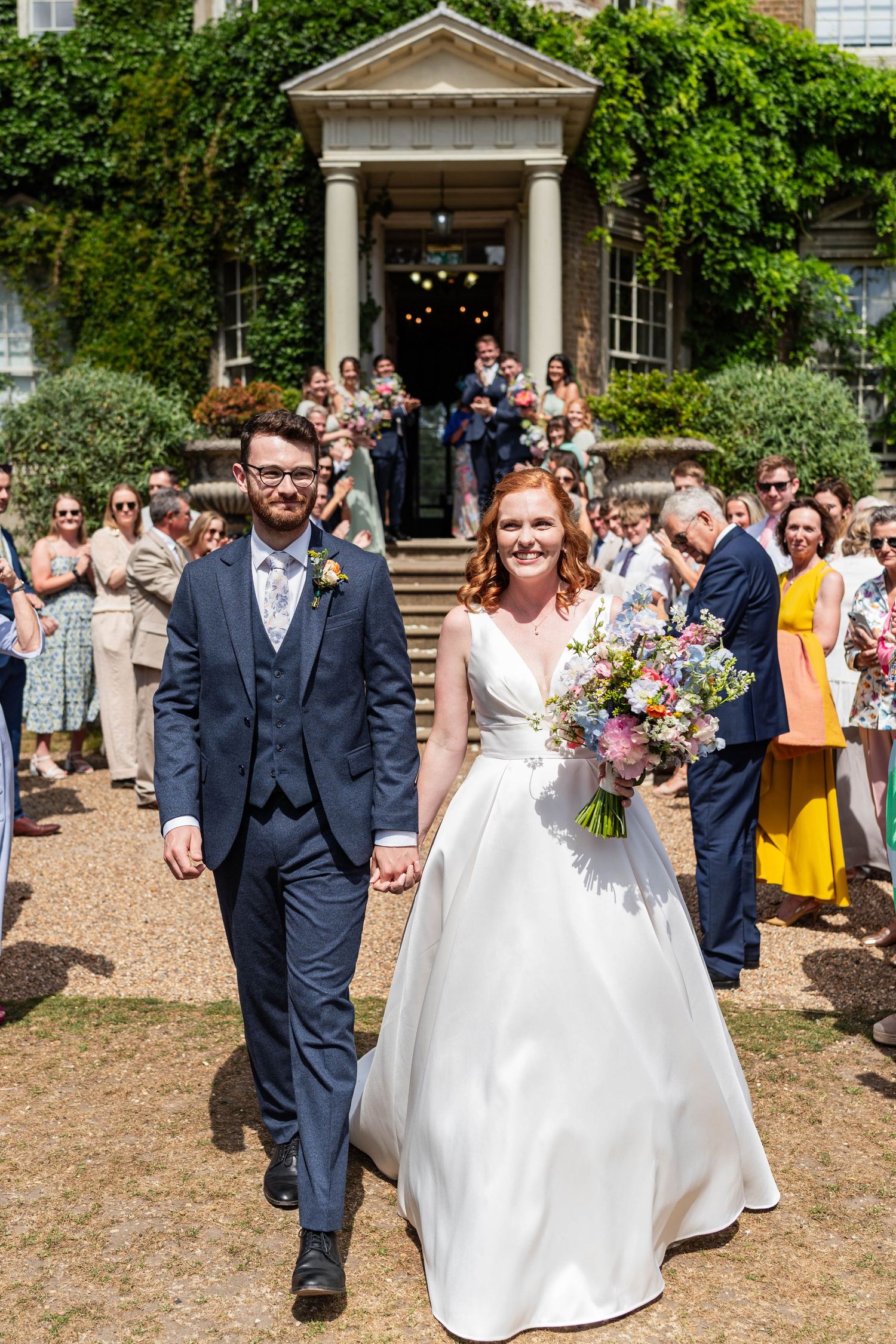 Beautiful stately home wedding in Surrey.
The brides wore her auburn hair down in bouncy curls with a braid on the side.