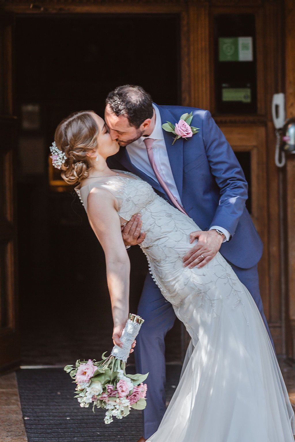 A romatic kiss at this Surrey wedding.
Beautiful low chignon bun and dewy makeup.