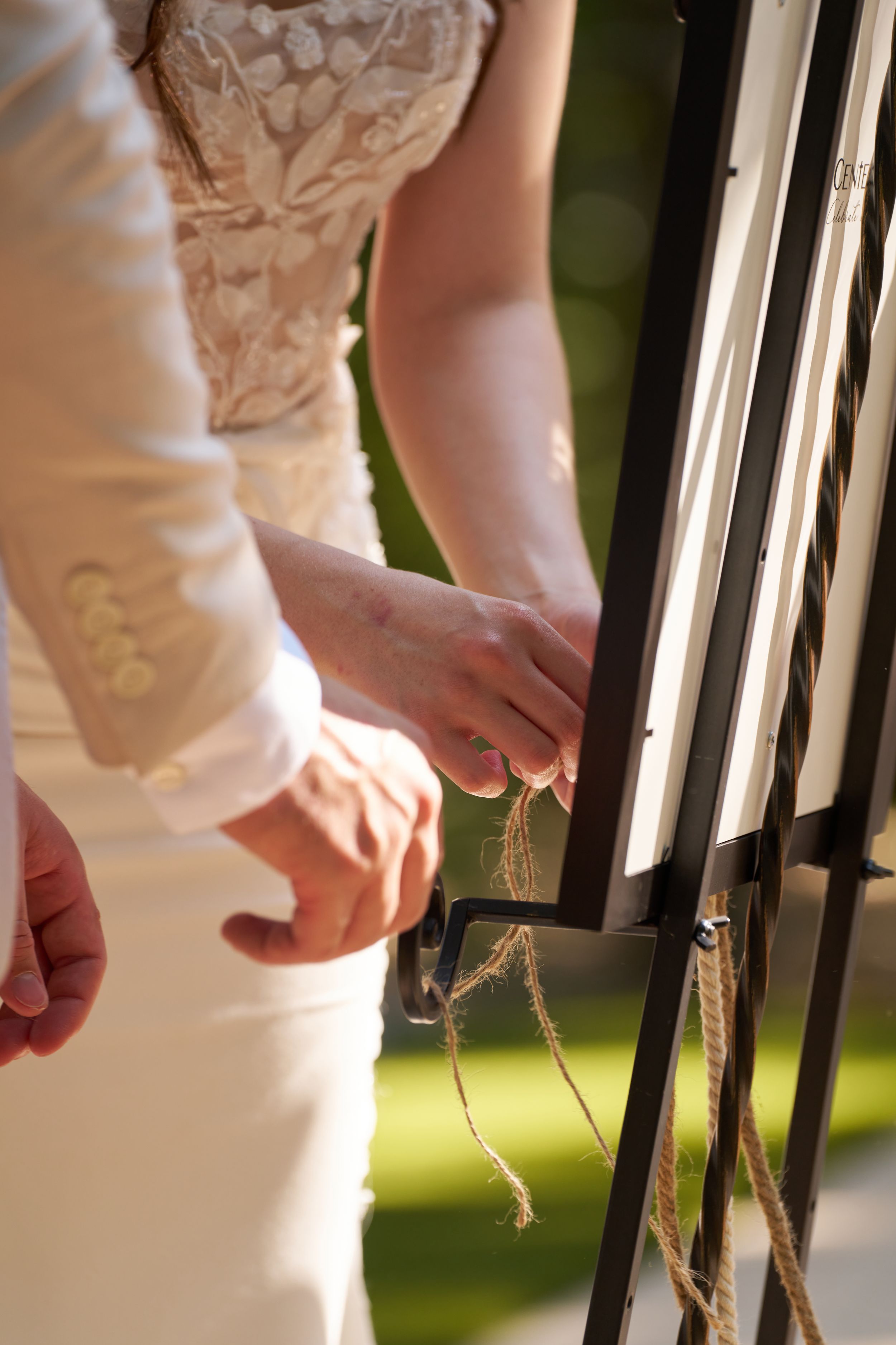 Close-up detail shots of delicate white lace on formal attire.