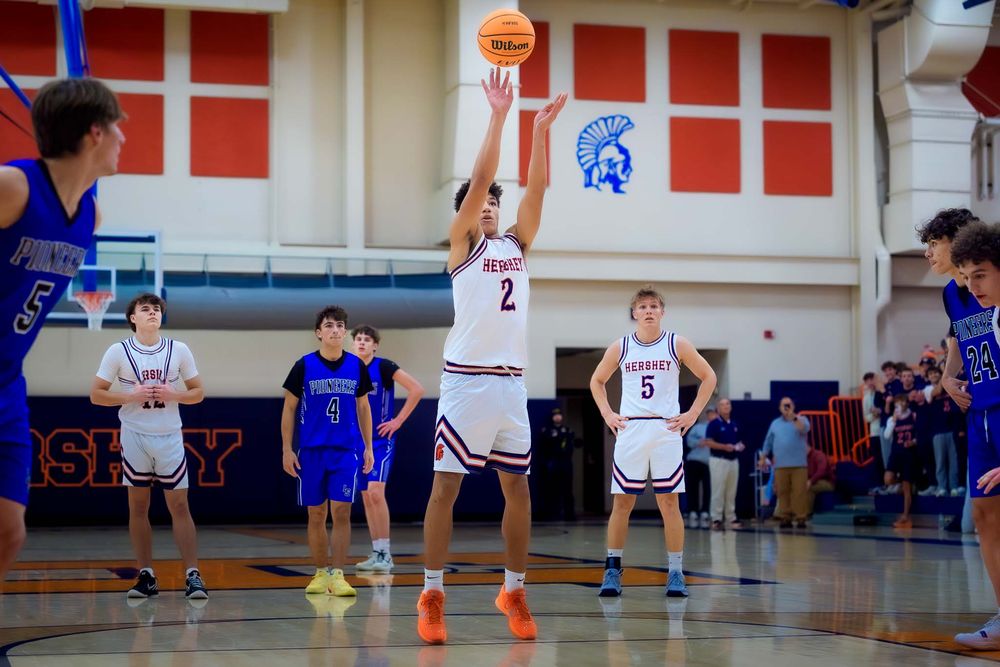 Cam Sweeney takes a free throw shot during the basketball game that is his 1,000 career point.