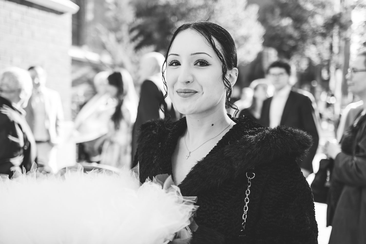 Elegant black and white photo montage of wedding guests enjoying a formal celebration.