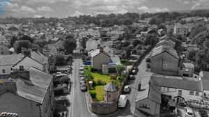 Aerial panoramic view of a residential neighborhood with houses and streets in black and white.