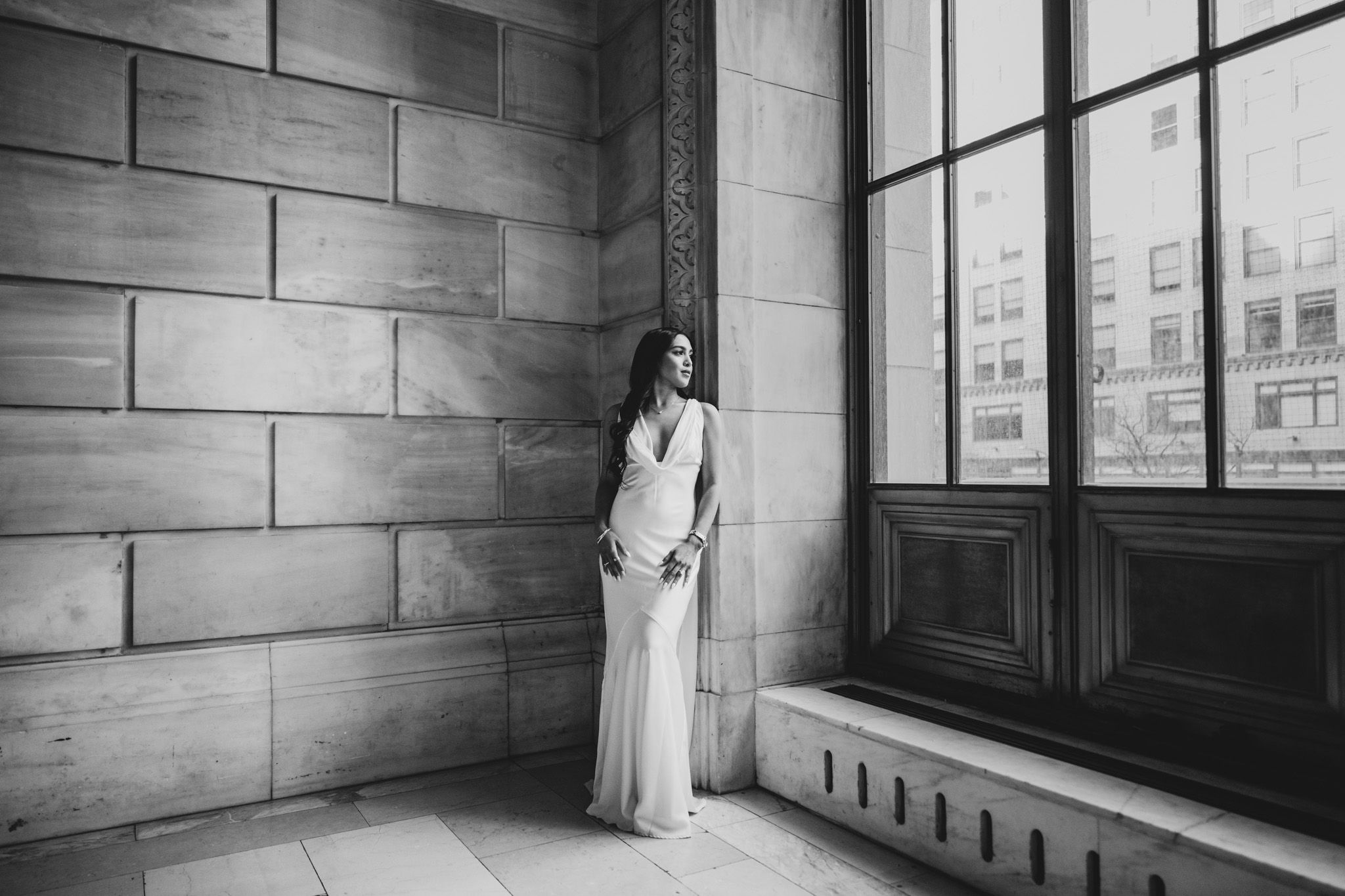 Artistic black and white photos showing architectural details and window light in stone hallway.