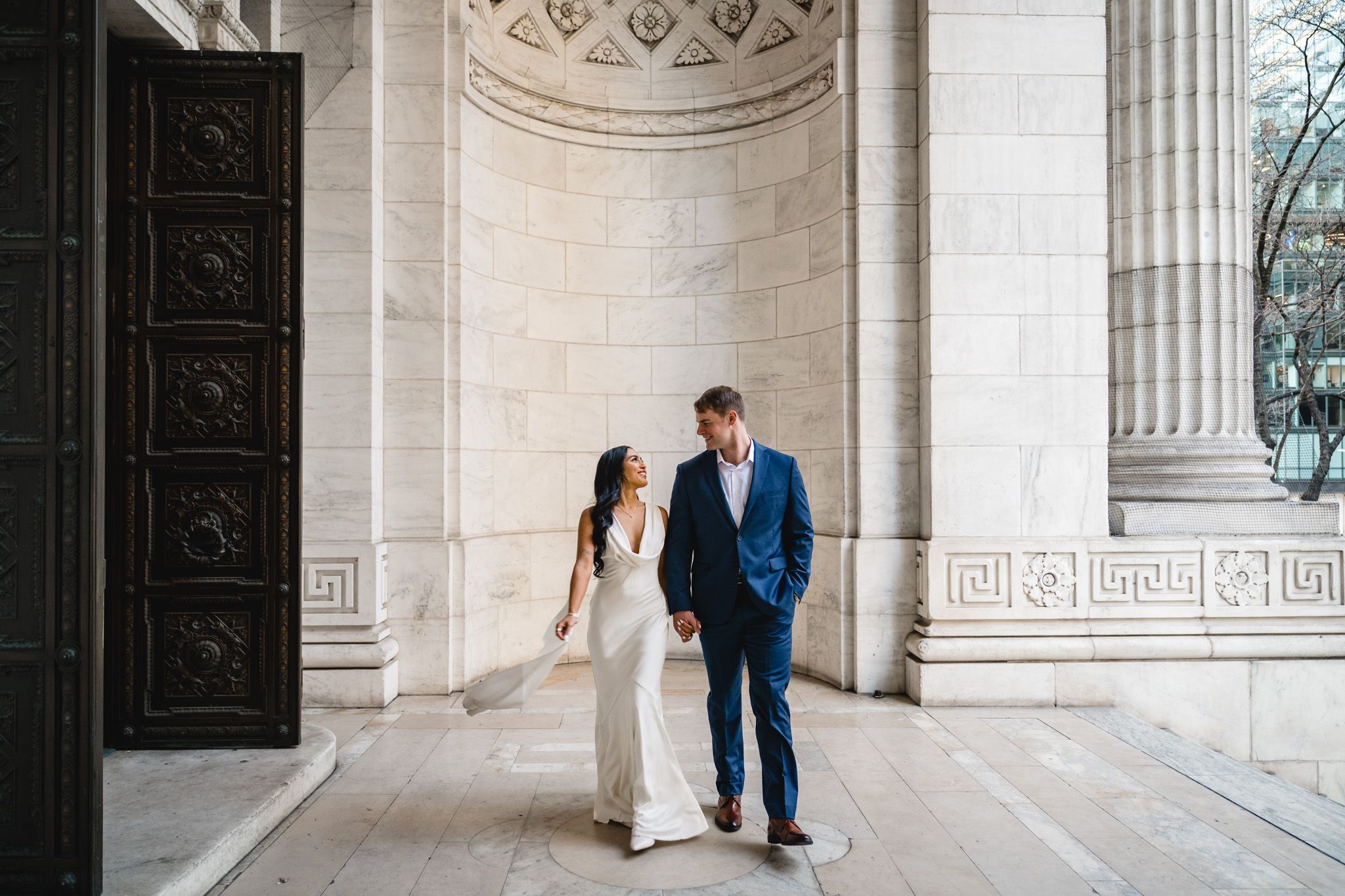 Elegant architectural scene with columns and stone walls in classic building interior.