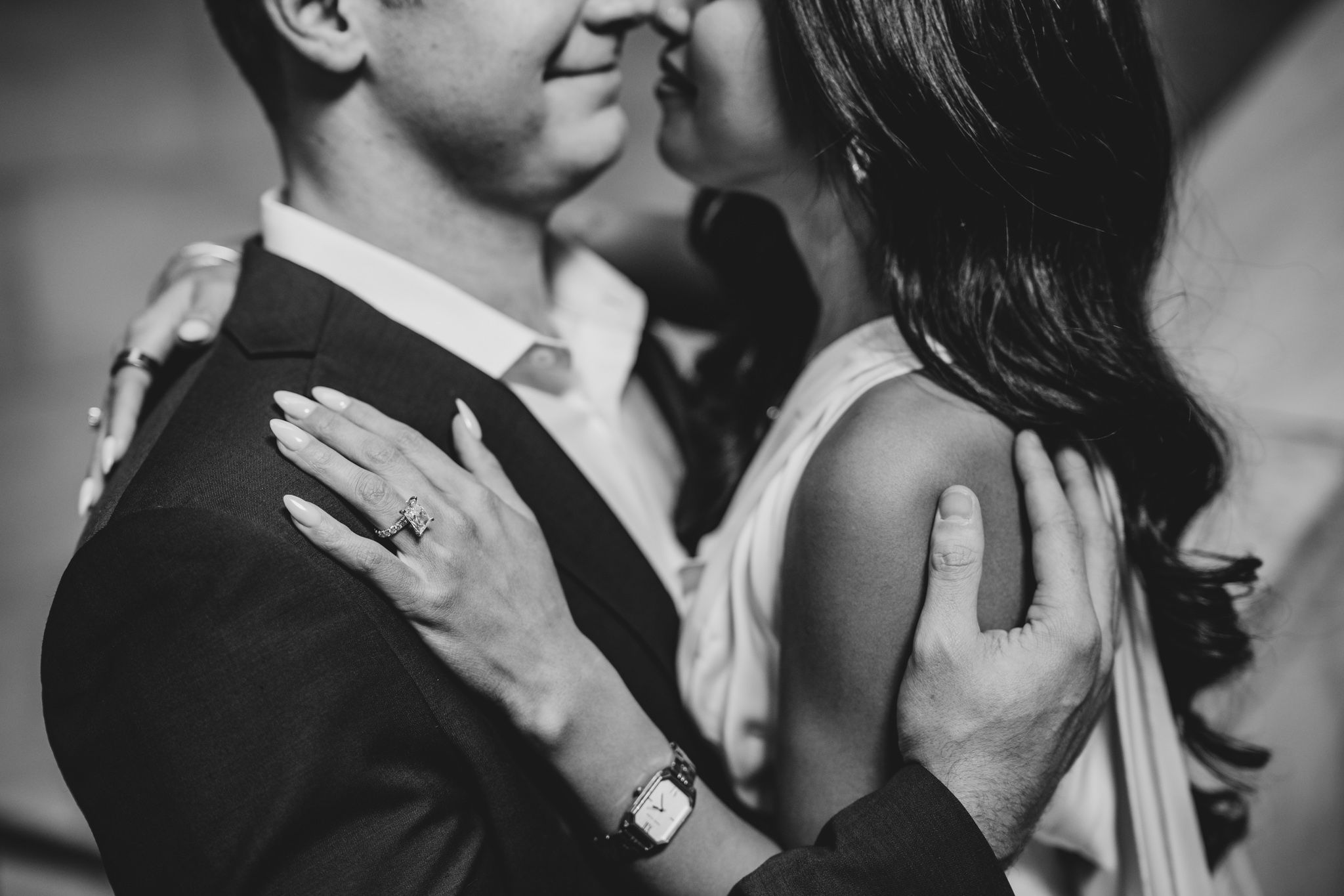 Close-up black and white portrait of loving couple sharing tender moment.