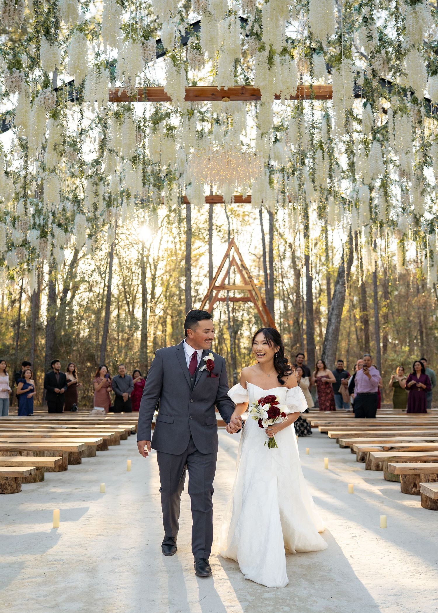 Twilight elopement ceremony of the Barrillas Family in Montgomery TX, with warm, moody light