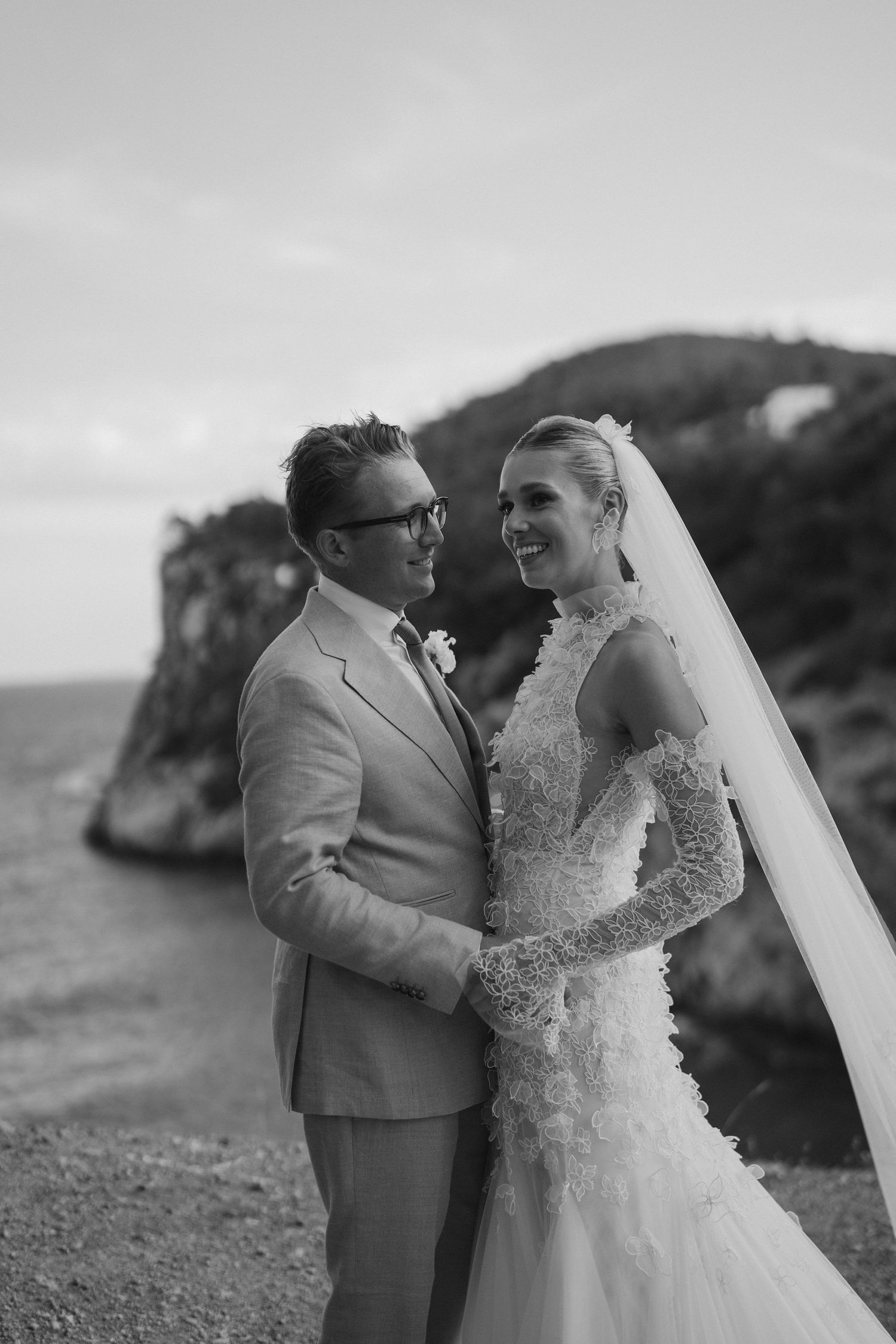 Bride and groom laughing on cliffs at Amante in ibiza