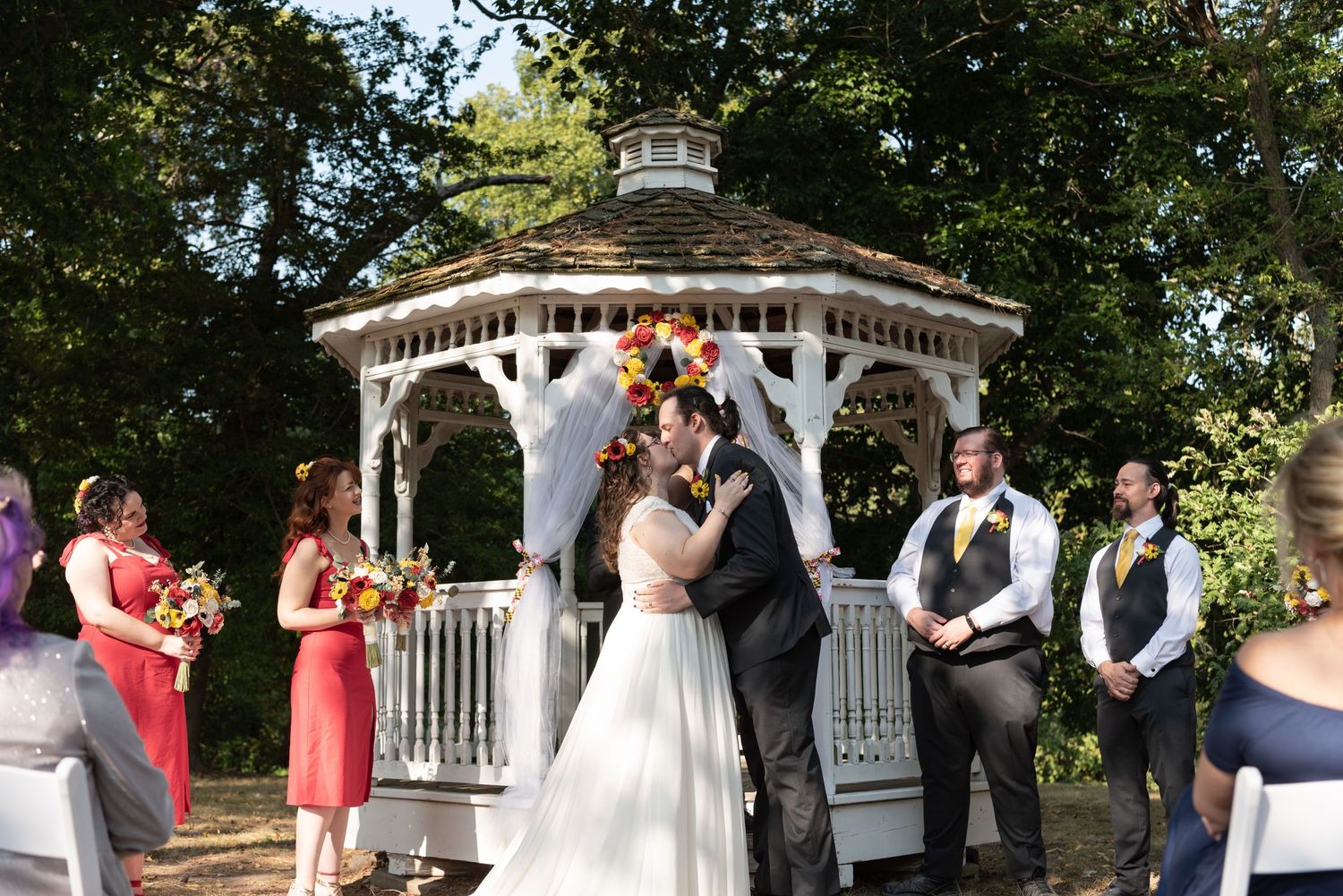 Bride and Groom sharing their first kiss during their wedding ceremony at an affordable Maryland Wedding Venue