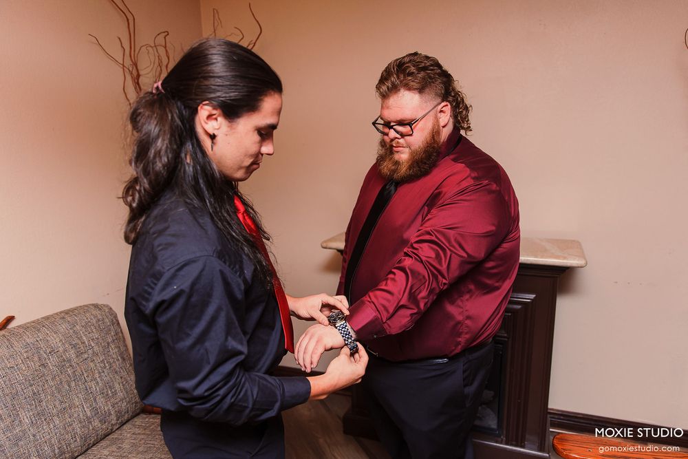 Two people in business attire are engaged in a series of professional interactions at a desk.