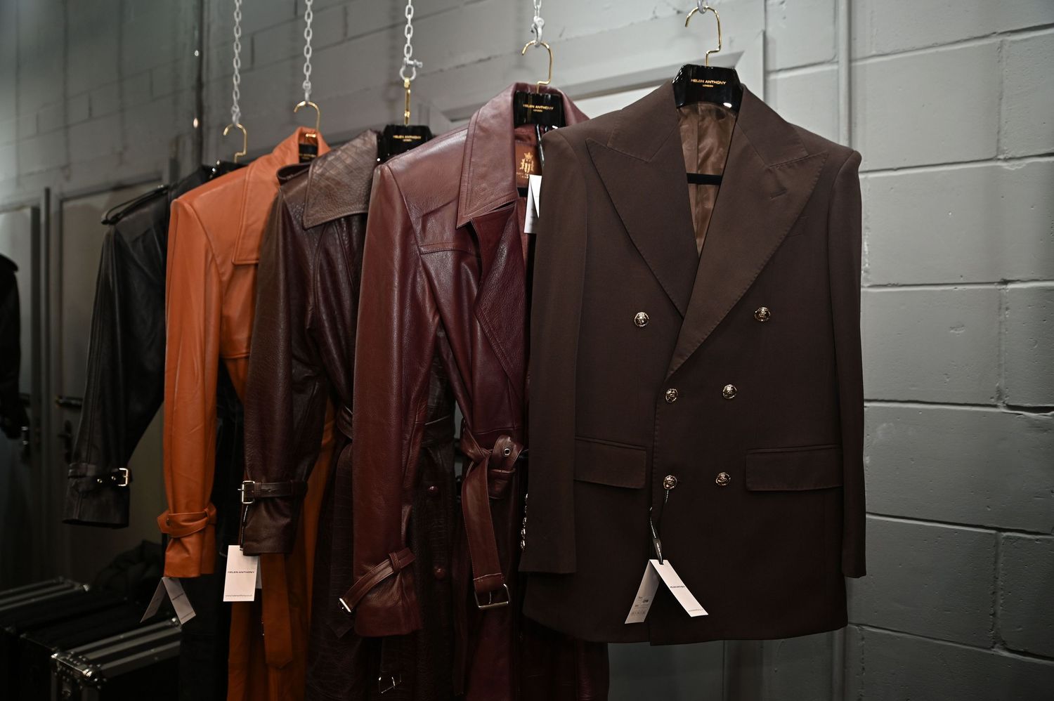 Jackets hang on a rail, showcases the designers outfits during London Fashion Week.